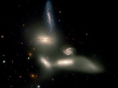 The Seyfert's sextet, a compact group located at z=0.014 and composed by four bounded galaxies, a background one located z=0.066, and a tidal tail.
Credit: NASA, English (Manitoba), Hunsberger, Zonak, Charlton, Gallagher (PSU) and Frattare(STScI)